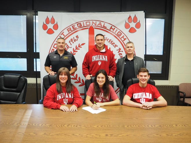 Submitted Photo — High Point's Zoe Tiger, seated middle, signs her National Letter of Intent to continue her soccer career at Indiana University next fall. Pictured are seated from left to right - mother Cindy, Zoe, and brother Troy. Standing from left to right are Director of Athletics/Assistant Principal Todd Van Orden, father Jahn, and Head Girls' Soccer Coach Kevin Fenlon.