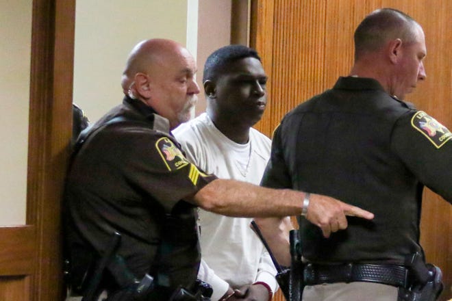 Ibrahim Yazeed, center, appears in court for a hearing on the disappearance of college student Aniah Blanchard, on Wednesday, Nov. 20, 2019 in Opelika, Ala. Yazeed is charged with kidnapping in the disappearance of Blanchard, the stepdaughter of UFC heavyweight Walt Harris. A judge ordered Yazeed to submit a DNA sample as requested by prosecutors. (Hannah Lester/Opelika-Auburn News via AP, Pool)