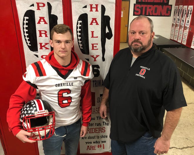 Orrville junior QB Cooper Haley (left) and his father Jason Haley are both a part of the Red Riders' quest for back-to-back state titles. Cooper starts at quarterback, while Jason coordinates the defense as a coach. Jason was also a standout at Orrville during his playing days.