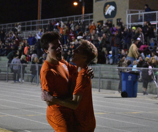 East Lincoln’s Pearson Cunningham and Chase Gilley celebrate after scoring a goal in the second half of Tuesday’s West 2A boys soccer final. [JOE HUGHES/Gaston Gazette]