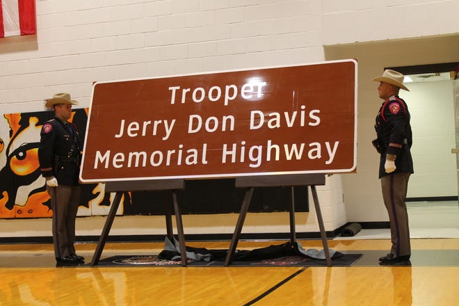 A sign memorializing Texas Department of Public Safety Highway Patrolman Jerry Don Davis, who was killed on duty in 1980, was revealed Thursday Nov. 21, 2019 at Slaton High School. [Sarah Self-Walbrick/A-J Media]