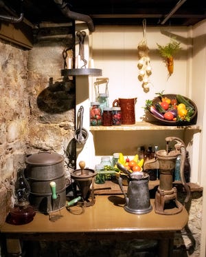 The kitchen in the Van Kirk Museum in Sparta displays some vintage utensils .