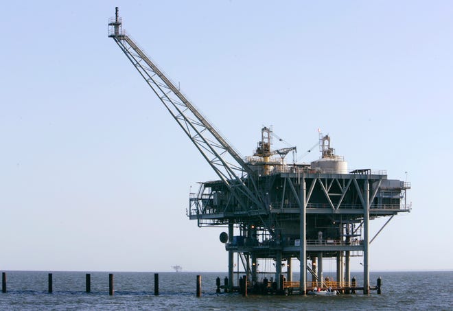 This April 13, 2007, file photo, shows a natural gas platform off the coast of Fort Morgan, Ala. The federal agencies that make and enforce offshore oil and gas leases will encourage new wells in shallow Gulf of Mexico waters by allowing some reduced-royalty or even royalty-free production if owners can prove they need it. Officials say $20 billion worth of oil and gas may go untapped without changes described in a report issued Tuesday, Nov. 19, 2019.