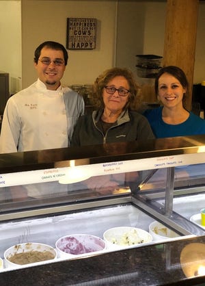 Bloom'n Cow Ice Cream and Gelato owner Dawn Lewis, center, poses in the shop with her son Nick and daughter Allison. [Courtesy photo]