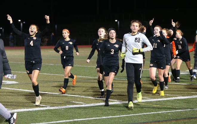 Members of Plainfield’s girls soccer team celebrate their 3-0 victory over Notre Dame-Fairfield in the Class M semifinals Wednesday at Middletown High School. [Emily J. Tilley/For The Bulletin]