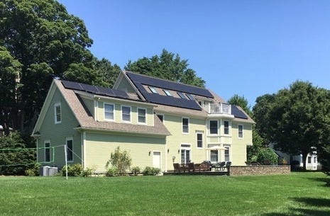 Bob and Martha Collins of Rice Street installed 41 solar panels five years ago, which paid back within four years. The current Municipal Light Plant rebate program, to expire next summer, and government tax credits can help reduce installation costs by two-thirds. [Courtesy Photo]