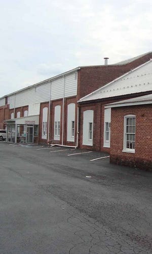 The historic brick building that houses the Greencastle Antique Mall has been home to many business over the years. It will be auctioned off Saturday.
