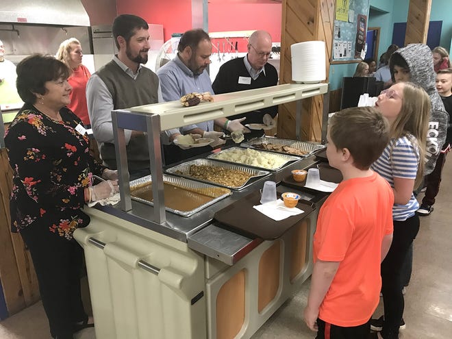 Local politicians Hilda Lando, Mark ReSue, Phil Palmesano and Bill Boland served Thanksgiving Dinner to kids, parents and community members Thursday at the Corning Youth Center. [Jeff Smith/The Leader]