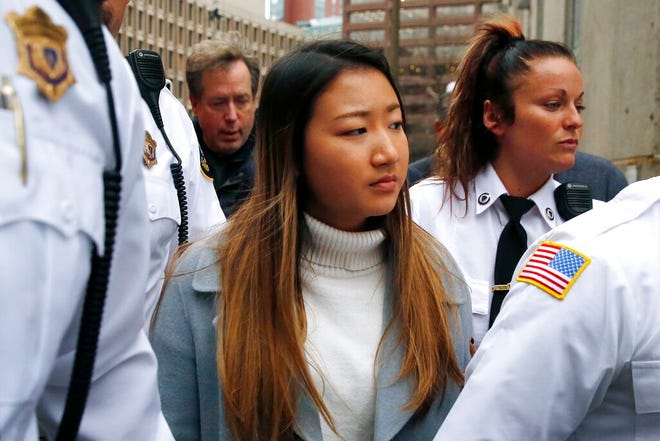 Inyoung You leaves Suffolk Superior Court in Boston, Friday, Nov. 22, 2019 after pleading not guilty to involuntary manslaughter. Prosecutors say You sent Alexander Urtula more than 47,000 text messages in the last two months of their relationship, including many urging him to "go kill yourself." (AP Photo/Michael Dwyer)