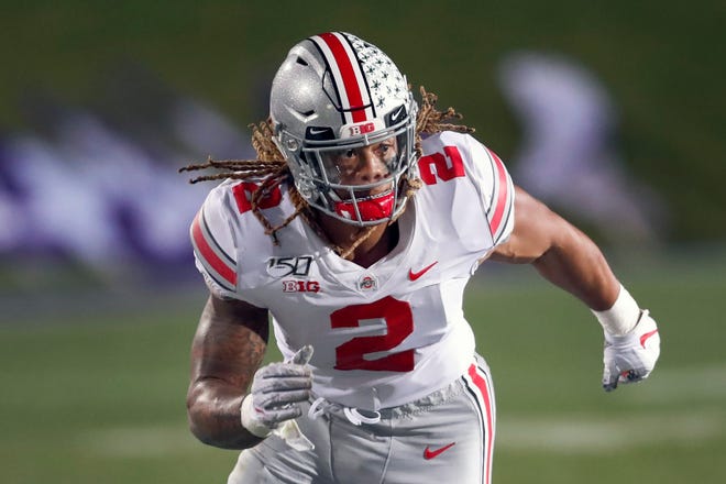 Ohio State defensive end Chase Young rushes the Northwestern quarterback during the second half of a game in October. Young returns to the Buckeyes after serving a suspension. [FILE/THE ASSOCIATED PRESS]