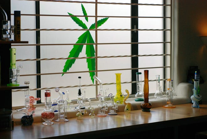 Marijuana equipment sits on display along a window at the Minerva medical cannabis dispensary in Santa Fe, N.M. in June The U.S. government is explicitly barring federal dollars for opioid addiction treatment from being used on medical marijuana. [MORGAN LEE/THE ASSOCIATED PRESS]
