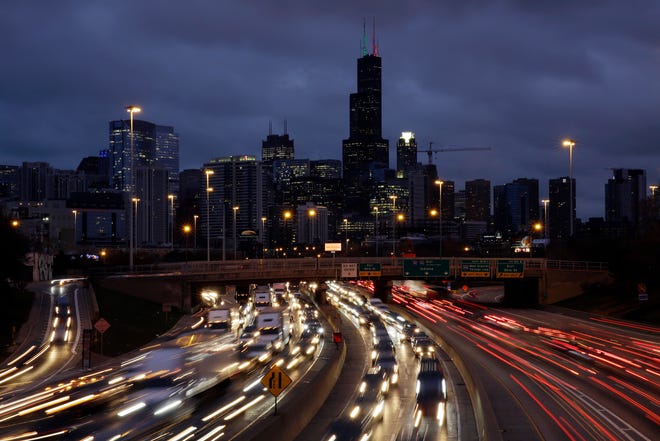 Traffic streaks across the John F. Kennedy Expressway at the start of the Thanksgiving holiday weekend last year in Chicago. The Transportation Security Administration said Nov. 13 that it expects to screen more than 26.8 million passengers from Nov. 22 through Dec. 2, a 4% increase over the comparable period last year. [Kiichiro Sato/The Associated Press]