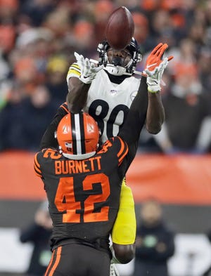 Cleveland Browns strong safety Morgan Burnett (42) breaks up a pass intended for Pittsburgh Steelers wide receiver Johnny Holton (80) during the first half of an NFL football game, Thursday, Nov. 14, 2019, in Cleveland. (AP Photo/Ron Schwane)