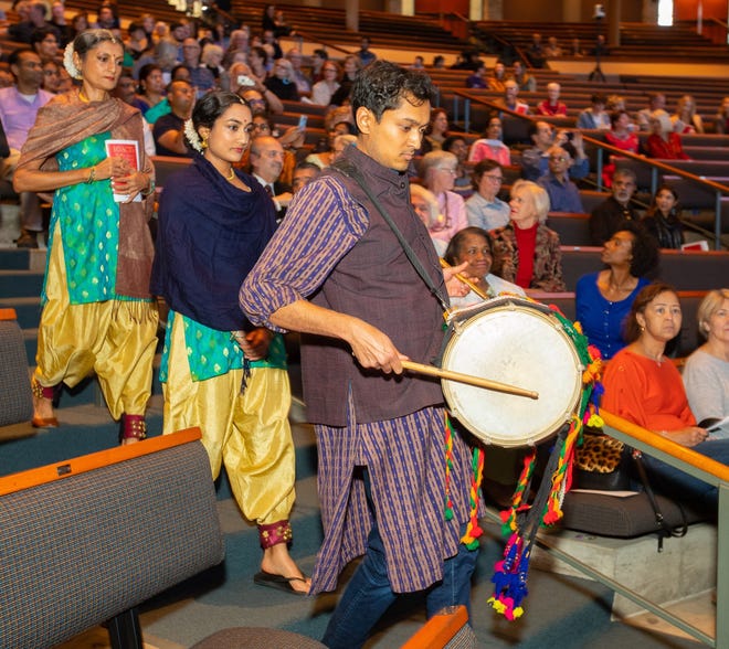 The procession of faith leaders follow percussionist Rishi Bajekal on stage at the iACTS's 35th Annual Interfaith Day of Thanks on Sunday, The celebration, hosted by Austin’s Hindu community, took place at Riverbend Church. [JOHN GUTIERREZ/FOR STATESMAN]