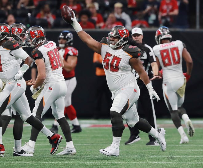 Tampa Bay Buccaneers defensive lineman Vita Vea celebrates his touchdown catch to take a 19-10 lead over the Atlanta Falcons during the second quarter Sunday in Atlanta. The Buccaneers won 35-22. [Curtis Compton / Atlanta Journal-Constitution via AP]