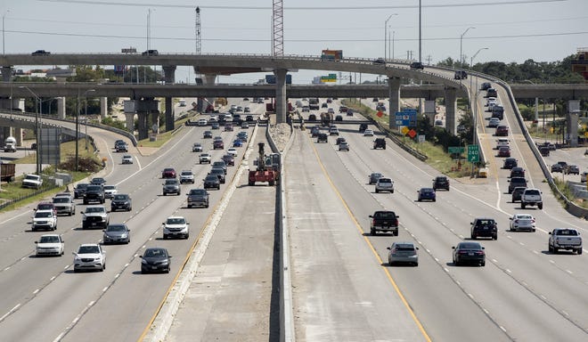 Traffic moves on Interstate 35 in this view looking north from East St. Johns Avenue in Northeast Austin. Holiday travelers will mix with commuters on Wednesday, the busiest day for Thanksgiving traffic, and urban commutes could last up to four times longer than normal according to AAA Texas. [JAY JANNER/AMERICAN-STATESMAN]