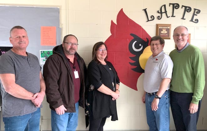 Standing on the left are Loudonville High School class of 1984 members Ken Phillips, Ron Lance and Crystal Ashby. Standing on the right are Mike Bandy, president of the L-P School Foundation, and Jim Cutright, executive director of the Ashland County Community Foundation.