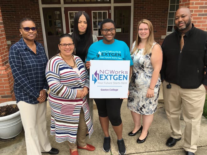 Shown above, from left, are youth specialist Tina Merriweather, youth specialist Natacha Barbosa, program director Tamara Jones, program participant Kira Pitts, youth specialist Elizabeth Johnson, and youth specialist Eddie Taylor. [BILL POTEAT/THE GAZETTE]