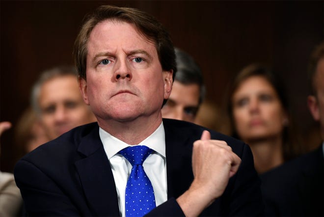 Then-White House counsel Don McGahn listens as Supreme court nominee Brett Kavanaugh testifies in September 2018 before the Senate Judiciary Committee on Capitol Hill in Washington. A federal judge has ordered McGahn to appear before Congress in a setback to President Donald Trump’s effort to keep his top aides from testifying. The outcome could lead to renewed efforts by House Democrats to compel testimony from other high-ranking officials, including former national security adviser John Bolton. [SAUL LOEB/THE ASSOCIATED PRESS (FILE)]