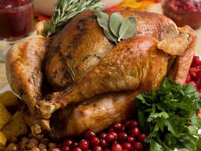 Food safety experts say raw turkeys shouldn't be rinsed, since that can spread harmful bacteria. Cooking should kill any germs. But bacteria can still spread in other ways, so washing and sanitizing hands and surfaces is still important. [LARRY CROWE/THE ASSOCIATED PRESS (FILE)]