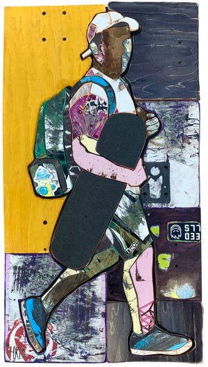 A subject carries a skateboard in this untitled work by the artist Keenan who started creating art work by cutting up pieces of old skateboards. [COURTESY IMAGE]