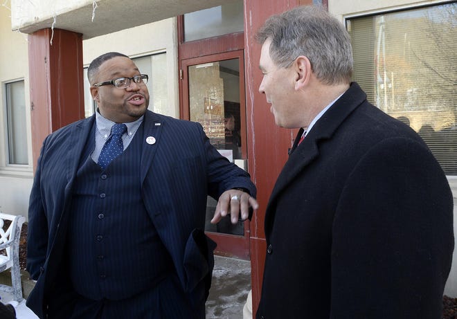 Pennsylvania Secretary of the Department of Community and Economic Development Dennis Davin, right, speaks with Aliquippa Mayor Dwan Walker during a January 2018 visit in which Davin announced a $3.3 million community development grant for the city. On Monday, Davin said Aliquippa would receive $26,500 to create a new comprehensive plan to help guide it out of distressed city status while the New Brighton area and Brighton Township would also receive funding for planning purposes. [BCT staff file]