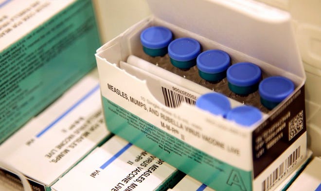 In this March 27, 2019, file photo, vials of measles, mumps and rubella vaccine sit in a cooler at the Rockland County Health Department in Pomona, N.Y. [AP Photo/Seth Wenig, File]