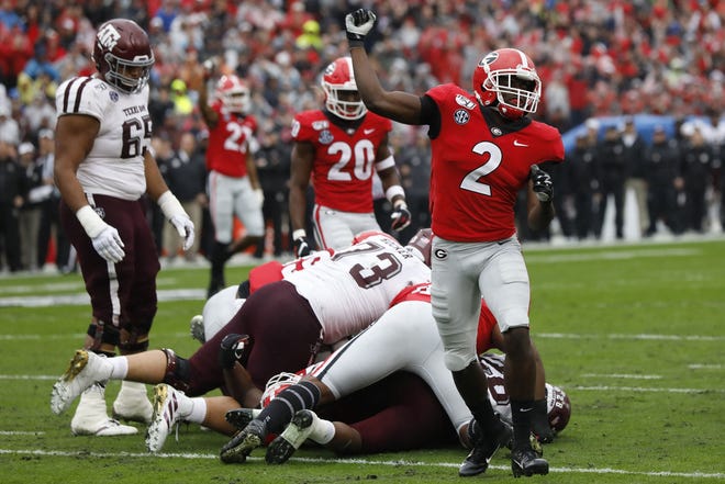 Georgia defensive back Richard LeCounte (2) celebrates Saturday after making a stop in the first half of a game between Georgia and Texas A&M in Athens. [Joshua L. Jones/Athens Banner-Herald via AP]