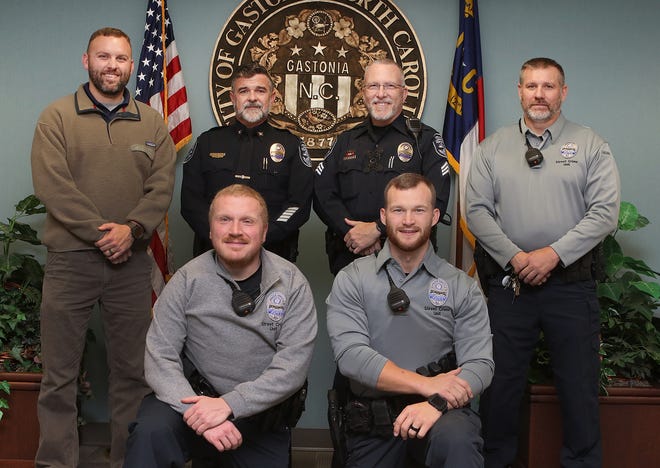 Several officers at the Gastonia Police Department have been taking part in No Shave November to raise money for North Carolina Special Olympics. (L-R standing) Detective Eric Seagle, Assistant Chief Travis Brittain, Sgt. Scott Norton and Sgt. Thomas Doby. (L-R kneeling) patrol Officer Sam Barksdale and Patrol Officer Josh Wood. [Mike Hensdill/The Gaston Gazette]