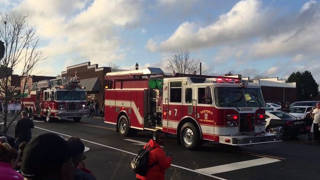 Gastonia Fire Department engines and ladder trucks make their way down Main Avenue during the 2018 Gastonia Christmas Parade. [Gazette file photo]