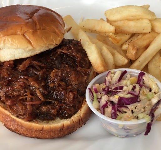 The pulled-pork sandwich, fries and coleslaw at Great House BBQ. [Kathryn Rem photo]