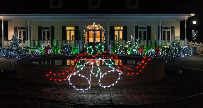 The December Nights & Holiday Lights extravaganza begins at the visitor's building at the Coastal Georgia Botanical Gardens. [Siobhan Egan/For Savannah Morning News]