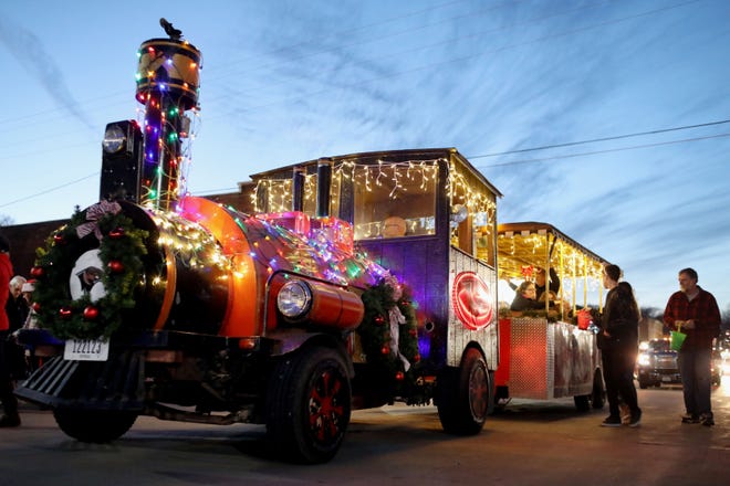The lighted Southeastern Community College float during the Lighted Holiday Parade Nov. 24, 2018 in downtown Burlington. This year's parade is Saturday in Burlington and will be followed by a tree lighting ceremony at Memorial Auditorium. [John Lovretta/thehawkeye.com]