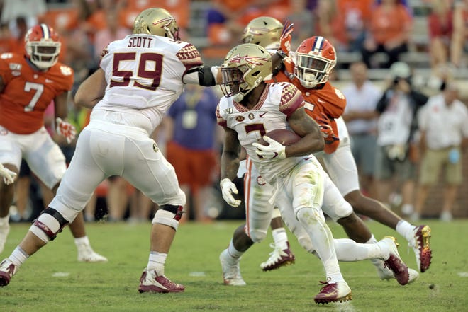 Florida State's Cam Akers rushes out of the backfield for a first down during the second half against Clemson on Oct. 12 in Clemson, S.C. [Richard Shiro/The Associated Press]