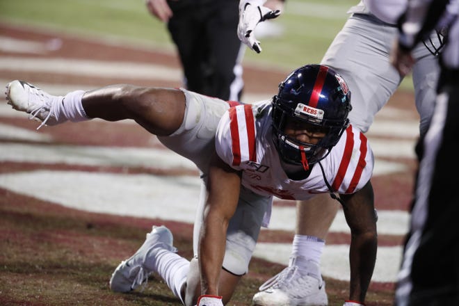 Mississippi wide receiver Elijah Moore (8) reacts following a touchdown by his team against Mississippi State in Starkville, Miss., Thursday, Nov. 28, 2019. The act resulted in a 15-yard penalty assessed on the extra point that was missed. (AP Photo/Rogelio V. Solis)