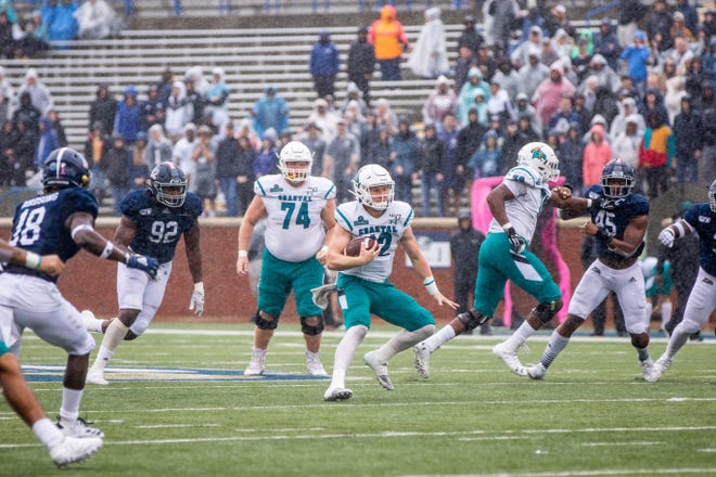 Coastal Carolina quarterback Bryce Carpenter tries to find an open running lane against the Georgia Southern defense earlier in the season. Carpenter is one of two quarterbacks the Chanticleers will feature Saturday versus Texas State. [HUNTER CONE/SAVANNAHNOW.COM]