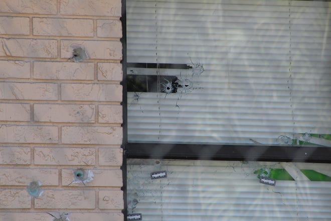 Bullet holes in a window at a home at 140 N. Franklin St. where Fausto Florez-Hernandez was killed Wednesday. [Frank Fernandez/News-Journal]