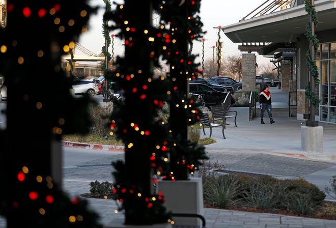 Customers walk between stores at West End Shopping Center, Tuesday, in Lubbock. [Brad Tollefson/A-J Media]