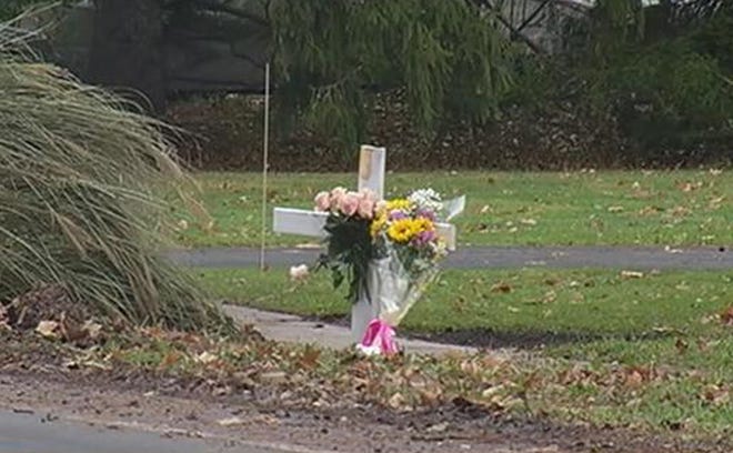 A memorial is set up at the site on Edgewood Avenue in Brighton where a babysitter and two children were struck by a vehicle Wednesday. The babysitter and one of the children died. [NEWS 10NBC]