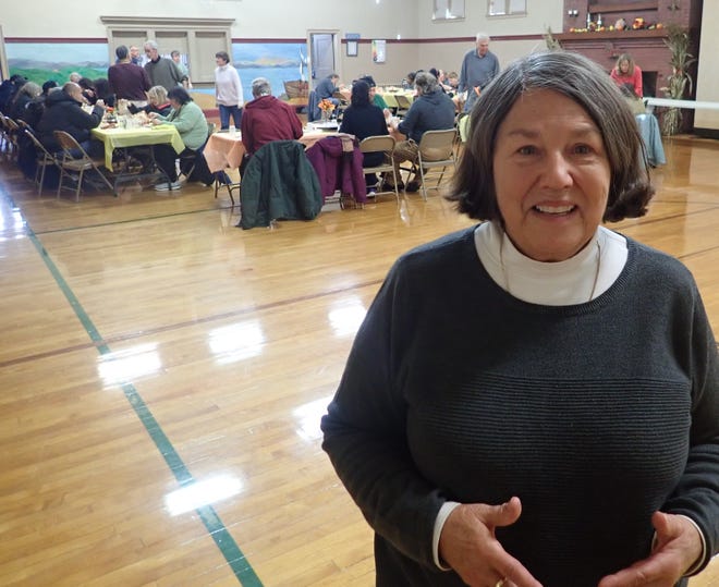 Linda Zwart of Manna House talks about the annual free Thanksgiving lunch. Thursday’s event was the 32nd served at the First Presbyterian Church on High Street, Newton. The Manna House also serves free lunches every weekday. {Photo by Bruce A Scruton/New Jersey Herald (NJH)]