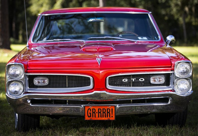 It took Mike Hughes three years to get his 1966 GTO just the way he wants it. One of the catch phrases for the GTO was that “It was all Tiger” — hence the GR-RRR! license plate. He has owned the car for 13 years and it is powered by a 455-cubic-inch motor that produces 400-430 horse power. [Doug Engle/Ocala Star-Banner]
