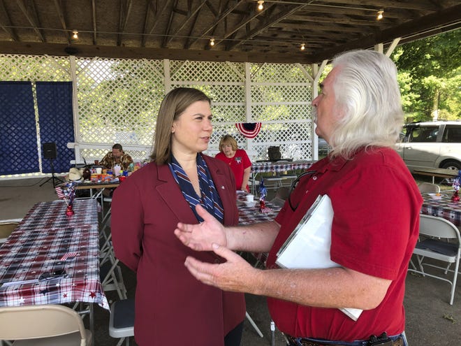 Rep. Elissa Slotkin, D-Mich., talks with a constituent after a veterans event on Friday, Aug. 2, 2019, at the Ingham County Fair in Mason, Mich. Slotkin, who flipped the 8th Congressional District by defeating a Republican incumbent in 2018, has not backed an impeachment inquiry of President Donald Trump. [AP Photo/David Eggert]