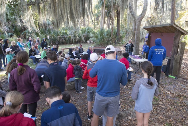 Treasure Hunters at Skidaway Island State Park prepare for the hunt on Friday during Performance Initiative's Black Friday Treasure Hunt. The groups scoured the park for clues, hoping to take home the $150 prize. [Will Peebles/Savannahnow.com]