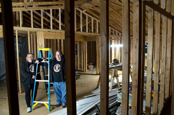 Barb Wicker and her fiance, Greg Donaldson, stand in the living room of their new home under construction in Hewittville Friday, Nov. 29, 2019. The couple lost their home to the 2018 tornado. [Ted Schurter/The State Journal-Register]