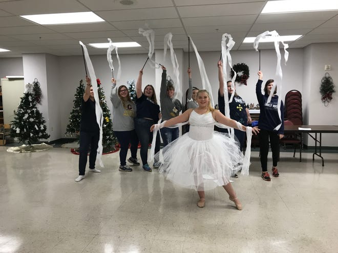 Cast members rehearse for the annual Madrigal Dinner Celebration in 2019.