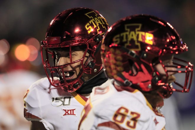 Iowa State wide receiver Sean Shaw Jr., left, smiles after scoring a touchdown during the first half of an NCAA college football game against Kansas State in Manhattan, Kan., Saturday, Nov. 30, 2019. (AP Photo/Orlin Wagner)