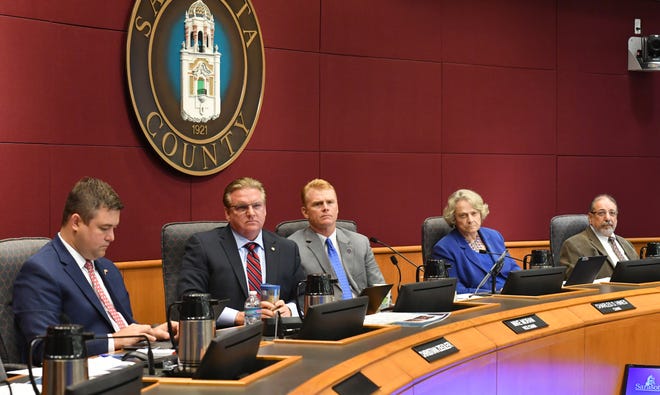 Sarasota County commissioners, from left, Christian Ziegler, Mike Moran Charles Hines, Nancy Detert and Alan Maio discuss redistricting during a meeting in August. A lawsuit is expected soon challenging the redistricting map that commissiones adopted last month. [Herald-Tribune staff photo / Mike Lang]