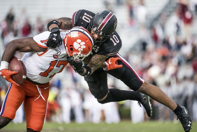 South Carolina defensive back R.J. Roderick (10) tackles Clemson wide receiver Cornell Powell (17) on Saturday in Columbia, S.C. Clemson defeated South Carolina 38-3. [SEAN RAYFORD/THE ASSOCIATED PRESS]