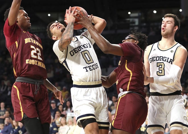 Georgia Tech guard Michael Devoe (0) battles Bethune-Cookman guard Wali Parks for the ball under the basket on Sunday night in Atlanta. Bethune-Cookman guard Isaiah Bailey, left, and Georgia Tech forward Evan Cole, right, look on. [CURTIS COMPTON/ATLANTA JOURNAL-CONSTITUTION VIA AP]