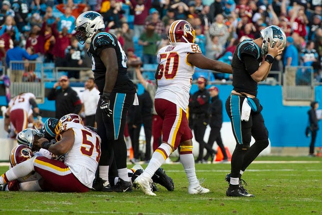 Carolina Panthers quarterback reacts after the final fourth-down play in Sunday's loss to the Washington Redskins.